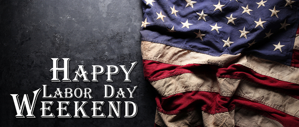 American flag with text reading Happy Labor Day Weekend on dark background