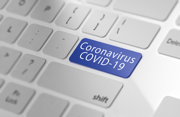 Blue keyboard key labeled 'Coronavirus COVID-19' on white keyboard