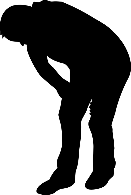 Silhouette of person bending forward at waist with arms positioned at sides