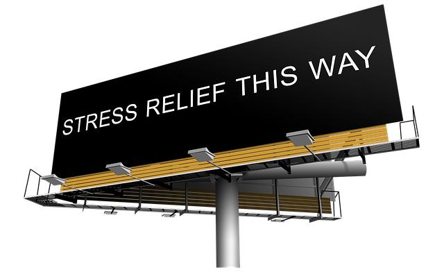 Billboard with text 'Stress Relief This Way' and arrow pointing right on black background with yellow accent